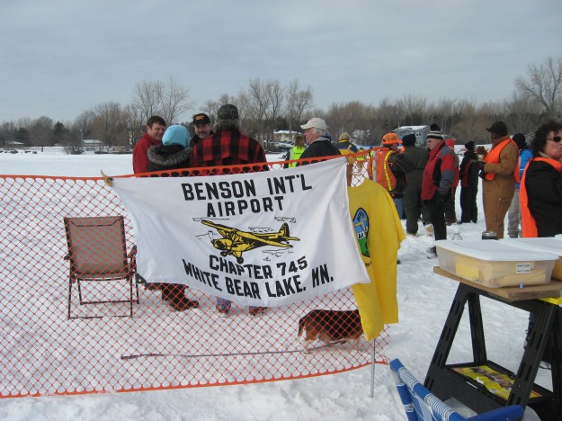 That's Minnesota, ice flying and ice fishing... on the same lake
